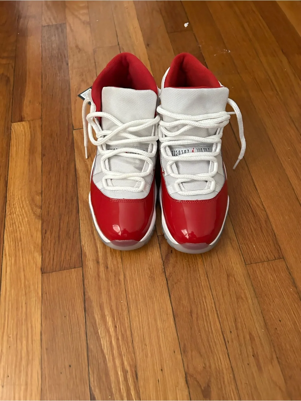 Jordan 11 Retro Low Top Sneakers in Red and White